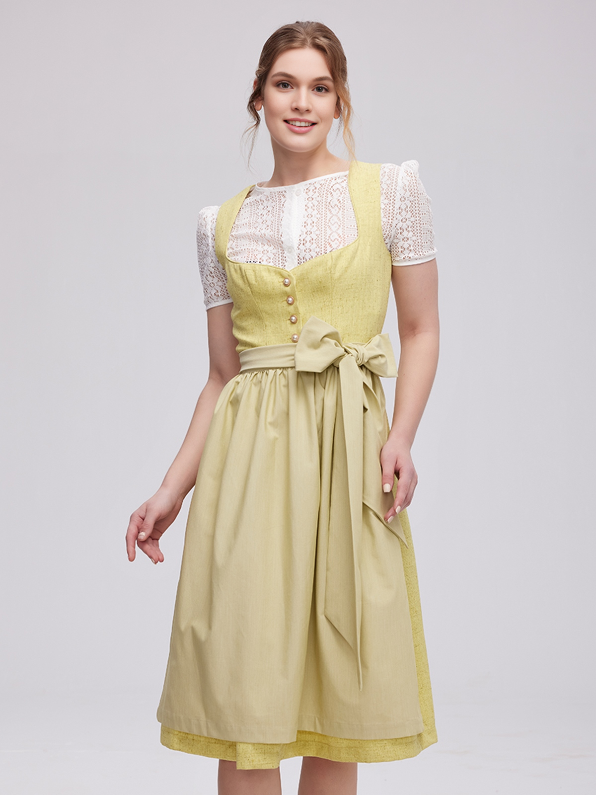 Modernes gelbes Dirndl mit frischem Design